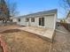 The backyard features a concrete patio and ample space, ready for landscaping at 5236 S Liverpool Way, Centennial, CO 80015