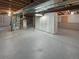 Unfinished basement with exposed ceiling, concrete floor, and utilities ready for customization at 5236 S Liverpool Way, Centennial, CO 80015