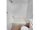 Bright bathroom features a white tiled wall and a tub at 5236 S Liverpool Way, Centennial, CO 80015
