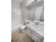 Bright bathroom with tub, toilet, vanity, and large mirror at 5236 S Liverpool Way, Centennial, CO 80015