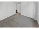 Bright bedroom with carpet, closet, and a view to the hallway at 5236 S Liverpool Way, Centennial, CO 80015