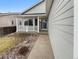 Charming front porch entry with a white railing and a walkway leading to the front door at 5236 S Liverpool Way, Centennial, CO 80015
