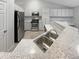 Well-equipped kitchen features stainless steel appliances and granite countertops for cooking at 5236 S Liverpool Way, Centennial, CO 80015