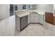 Kitchen with white cabinetry, stainless steel appliances and modern countertops at 5236 S Liverpool Way, Centennial, CO 80015