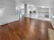 Spacious living area flows into the kitchen with hardwood floors and neutral paint at 5236 S Liverpool Way, Centennial, CO 80015