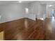 Open-concept living room featuring hardwood floors and ample natural light throughout the space at 5236 S Liverpool Way, Centennial, CO 80015