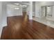 Open-concept living room featuring hardwood floors, modern lighting, and a neutral color palette at 5236 S Liverpool Way, Centennial, CO 80015