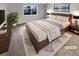 A primary bedroom with great natural light, modern décor, and stylish furnishings at 5236 S Liverpool Way, Centennial, CO 80015