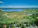 Aerial view of property near a lake and open spaces, showcasing its prime location at 4338 S Alton St, Greenwood Village, CO 80111