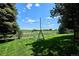 Private backyard with a swing set and well-maintained lawn, perfect for outdoor activities at 4338 S Alton St, Greenwood Village, CO 80111