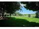 Lush, expansive backyard with mature trees offers shade and a serene outdoor space at 4338 S Alton St, Greenwood Village, CO 80111