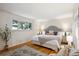 Serene bedroom with hardwood floors, soft lighting, and a comfortable bed, perfect for relaxation at 4338 S Alton St, Greenwood Village, CO 80111