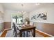 Elegant dining room with a wooden table, chandelier, and view of the backyard at 4338 S Alton St, Greenwood Village, CO 80111