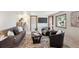 Inviting living room with comfortable seating, creating a welcoming space for relaxation and entertainment at 4338 S Alton St, Greenwood Village, CO 80111