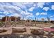 Playground featuring wooden climbing structures, stepping stones, and natural elements at 4338 S Alton St, Greenwood Village, CO 80111