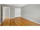 Spacious bedroom with hardwood floors and closet with sliding doors at 141 S Upham Ct, Lakewood, CO 80226