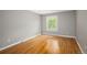 Bright bedroom with hardwood floors and large window at 141 S Upham Ct, Lakewood, CO 80226