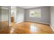 Spacious bedroom with hardwood floors, window, and closet at 141 S Upham Ct, Lakewood, CO 80226