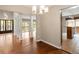 Open concept living and dining area with hardwood floors and ample natural light at 141 S Upham Ct, Lakewood, CO 80226
