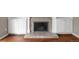 Close up of the fireplace featuring stone hearth and built-in shelving at 141 S Upham Ct, Lakewood, CO 80226