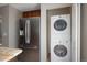 Stainless steel refrigerator and stacked washer/dryer hookups in the kitchen at 141 S Upham Ct, Lakewood, CO 80226