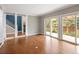Bright living room with hardwood floors and sliding glass doors to the outdoor patio at 141 S Upham Ct, Lakewood, CO 80226