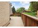 Backyard patio with beautiful flower beds, wooden fence and access to yard at 141 S Upham Ct, Lakewood, CO 80226