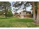 Home with a large manicured lawn at 141 S Upham Ct, Lakewood, CO 80226