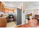 Well-equipped kitchen featuring stainless steel appliances and a seamless view to living room at 221 Jackson Ave, Firestone, CO 80520