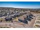 Aerial view of a suburban neighborhood showcasing uniform housing, neat streets and well-kept landscaping on a sunny day at 17857 Lapis Ct, Monument, CO 80132