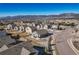 Scenic aerial view of a residential neighborhood with mountain views and well-maintained landscaping on a sunny day at 17857 Lapis Ct, Monument, CO 80132