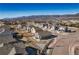 Scenic aerial view of a residential neighborhood with mountain views and well-maintained landscaping on a sunny day at 17857 Lapis Ct, Monument, CO 80132