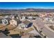 Aerial view of a property highlighting its proximity to local amenities, set against a stunning mountain backdrop at 17857 Lapis Ct, Monument, CO 80132