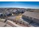 Aerial view of a backyard with a well-defined fence, landscaping features, and an inviting patio area at 17857 Lapis Ct, Monument, CO 80132