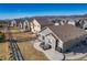Aerial view showcasing a private backyard with a hot tub and a well-manicured lawn in a serene residential setting at 17857 Lapis Ct, Monument, CO 80132