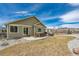 Backyard featuring lawn, patio, and hot tub at 17857 Lapis Ct, Monument, CO 80132
