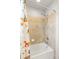 Bathtub and shower combination is enhanced by a fun shower curtain at 17857 Lapis Ct, Monument, CO 80132
