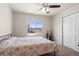 Bright bedroom features a large window and ceiling fan at 17857 Lapis Ct, Monument, CO 80132