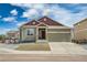 Charming home with an attached two-car garage, complemented by professionally landscaped front yard and neutral colored exterior at 17857 Lapis Ct, Monument, CO 80132