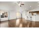 Open-concept living area with hardwood floors and large windows that provide an abundance of natural light at 17857 Lapis Ct, Monument, CO 80132