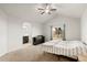 Bright and airy main bedroom with vaulted ceiling features a large window and leads to an ensuite bathroom at 17857 Lapis Ct, Monument, CO 80132