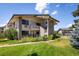 Exterior shot of building with stairs to upper units and well manicured landscaping at 645 Manhattan Pl # 106, Boulder, CO 80303