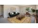 Cozy living room with natural light, comfortable seating, stylish decor, and a view of lush greenery at 645 Manhattan Pl # 106, Boulder, CO 80303