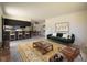 Bright and airy living room with an open floor plan that flows into the dining area and modern kitchen at 645 Manhattan Pl # 106, Boulder, CO 80303
