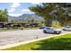 Picture of the parking lot with covered parking and views of the mountains in the background at 645 Manhattan Pl # 106, Boulder, CO 80303