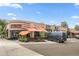 Beautiful street view of commercial property with outdoor patio, brick facade, and ample parking space at 4539 Tennyson St # 105, Denver, CO 80212