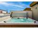Outdoor hot tub on a rooftop deck with wooden flooring and blue sky at 4539 Tennyson St # 105, Denver, CO 80212