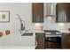 Modern kitchen with quartz countertops, stainless steel appliances and designer cabinetry and fixtures at 4539 Tennyson St # 105, Denver, CO 80212