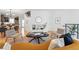 Bright living room features hardwood floors and a modern design with decorative fireplace and comfortable seating at 4539 Tennyson St # 105, Denver, CO 80212