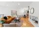 Modern living room with sleek hardwood floors, stylish seating, and an open floor plan concept at 4539 Tennyson St # 105, Denver, CO 80212
